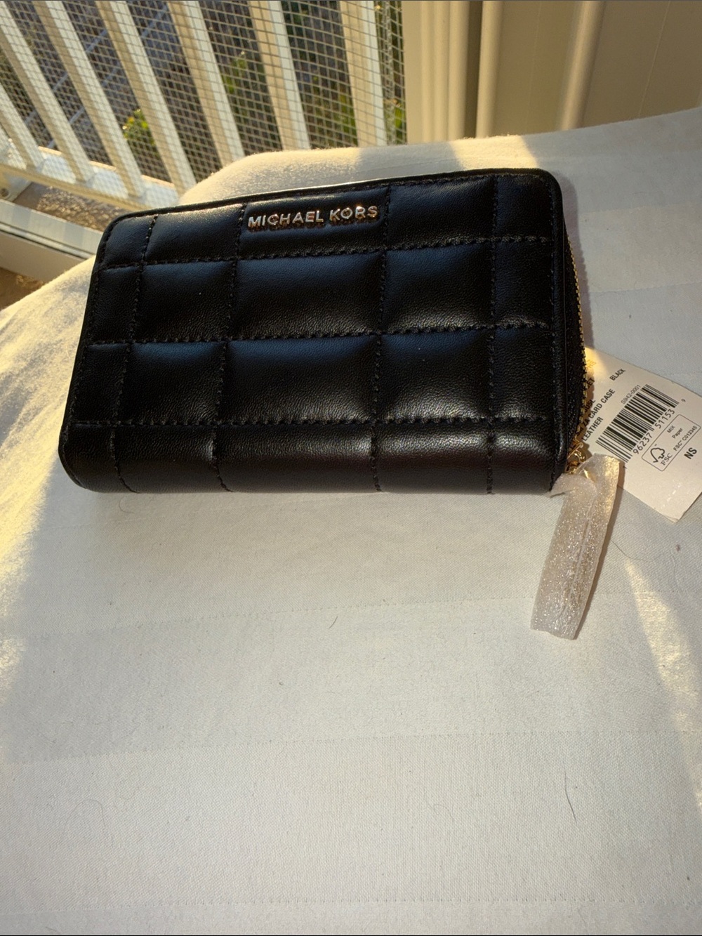 NWT - Michael Kors Small Black Quilted Zip Wallet with Gold Logo.
